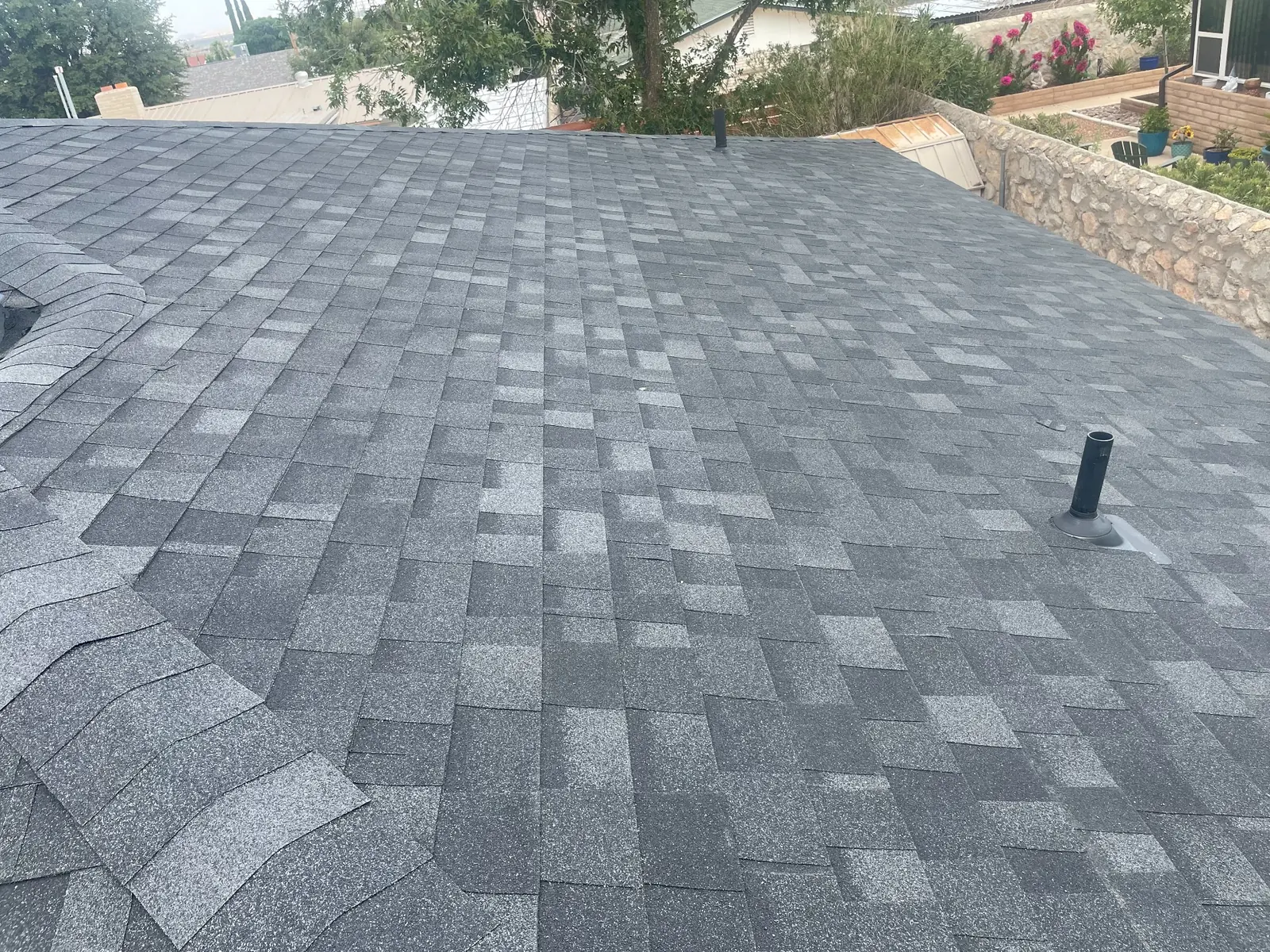 Gray architectural shingle roof in an El Paso neighborhood